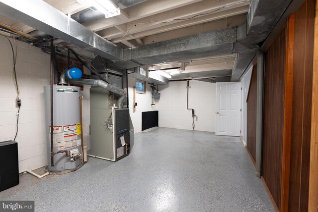 8700 Bluedale St, Alexandria, VA 22308 - unfinished basement featuring gas water heater, heating unit, and concrete block wall