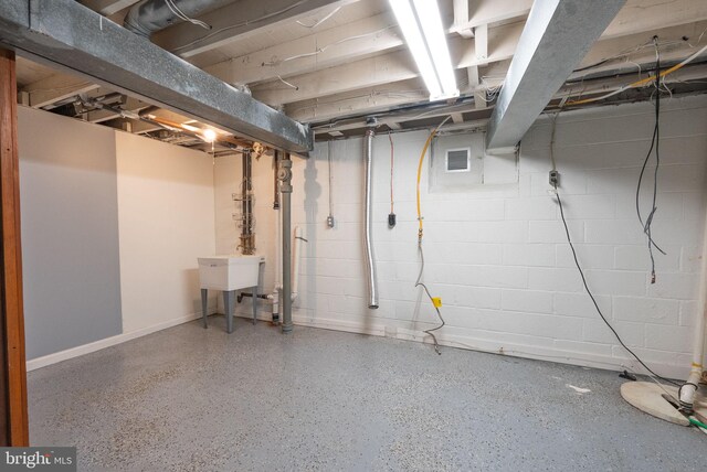 8700 Bluedale St, Alexandria, VA 22308 - unfinished below grade area featuring concrete block wall