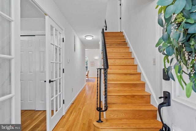 8700 Bluedale St, Alexandria, VA 22308 - staircase featuring wood finished floors and french doors