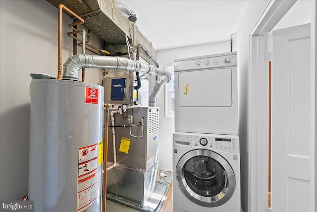 307 19th St NE, Washington, DC 20002 - laundry room featuring gas water heater and estacked washer and dryer