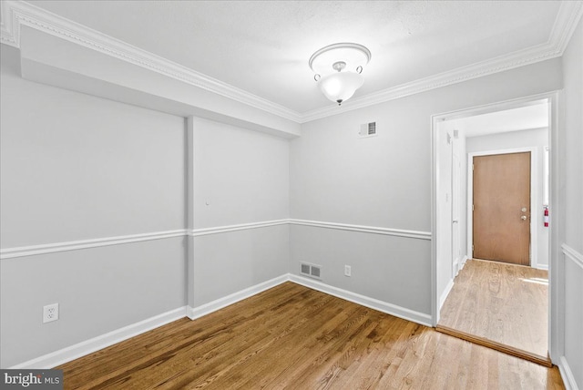 307 19th St NE, Washington, DC 20002 - empty room with wood finished floors and crown molding