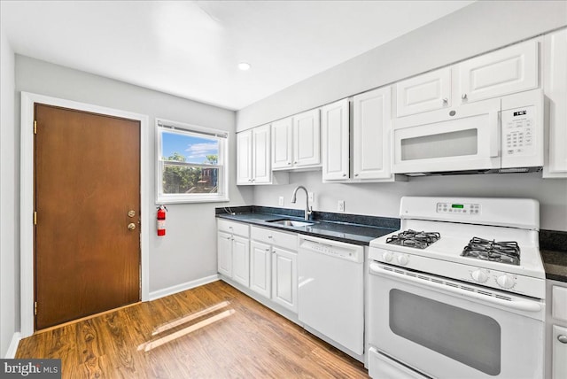 307 19th St NE, Washington, DC 20002 - kitchen with white appliances, dark countertops, white cabinetry, and recessed lighting