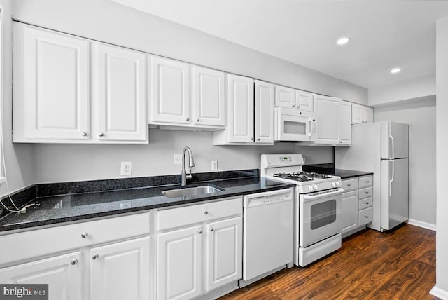 307 19th St NE, Washington, DC 20002 - kitchen featuring white appliances, white cabinets, dark wood-style flooring, recessed lighting, and dark stone countertops