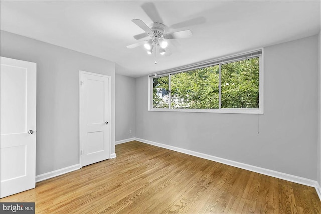 307 19th St NE, Washington, DC 20002 - unfurnished bedroom featuring light wood finished floors and a ceiling fan
