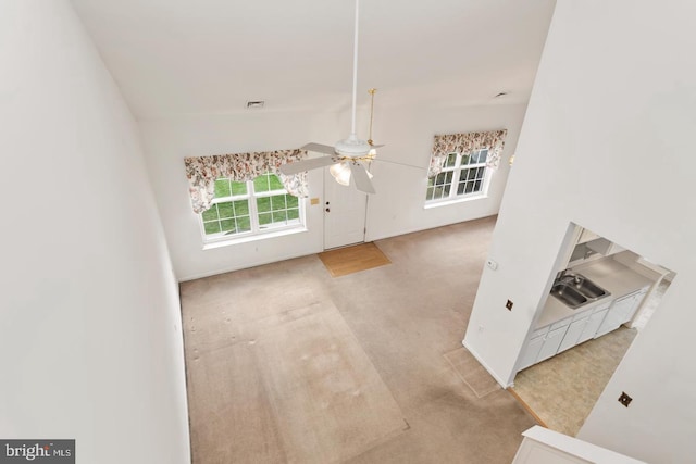 26 Courtyard Dr, Carlisle, PA 17013 - unfurnished living room with ceiling fan and carpet