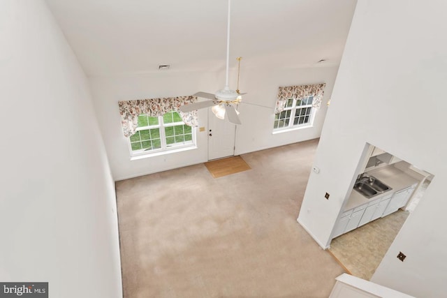 26 Courtyard Dr, Carlisle, PA 17013 - unfurnished living room featuring ceiling fan and carpet flooring