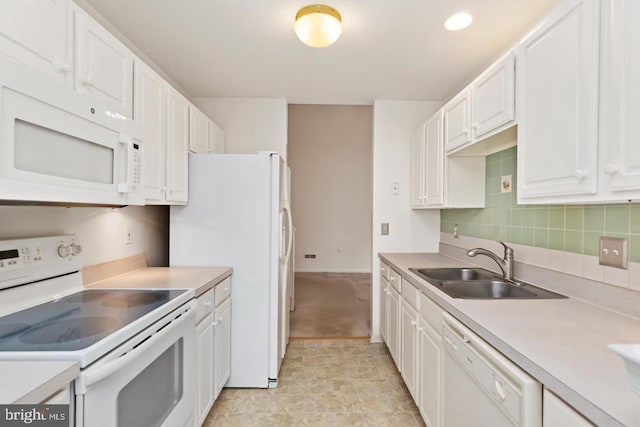26 Courtyard Dr, Carlisle, PA 17013 - kitchen with white appliances, white cabinetry, light countertops, and backsplash
