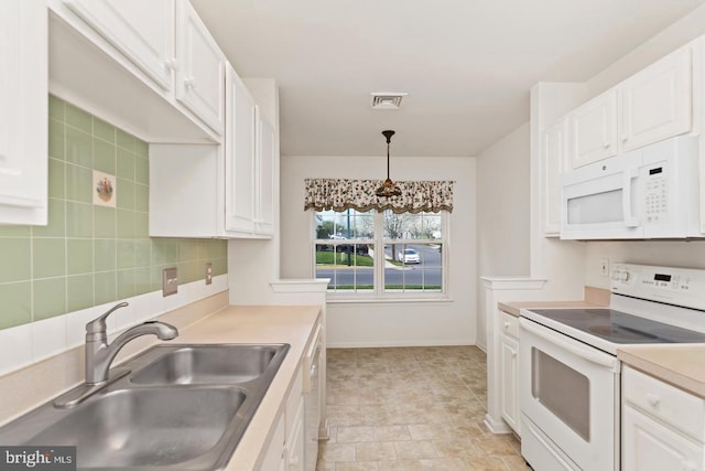 26 Courtyard Dr, Carlisle, PA 17013 - kitchen featuring white appliances, white cabinets, and light countertops