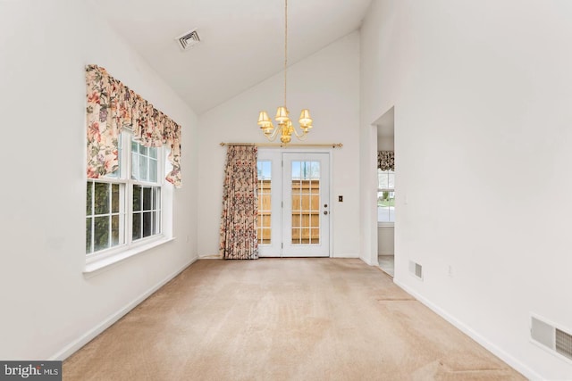 26 Courtyard Dr, Carlisle, PA 17013 - unfurnished dining area featuring a chandelier, carpet, and high vaulted ceiling