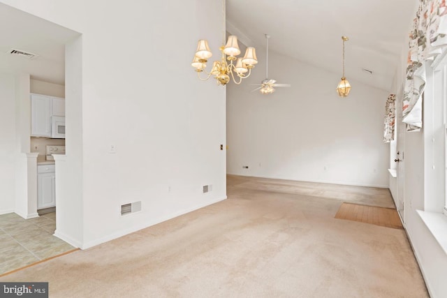 26 Courtyard Dr, Carlisle, PA 17013 - empty room featuring a chandelier, light carpet, a ceiling fan, and high vaulted ceiling