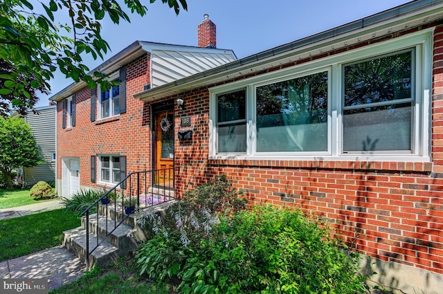 108 Strathdon Way, Lutherville Timonium, MD 21093 - split level home featuring brick siding, an attached garage, and a chimney