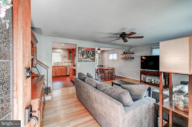 108 Strathdon Way, Lutherville Timonium, MD 21093 - living room featuring ceiling fan, light wood-style floors, and stairs