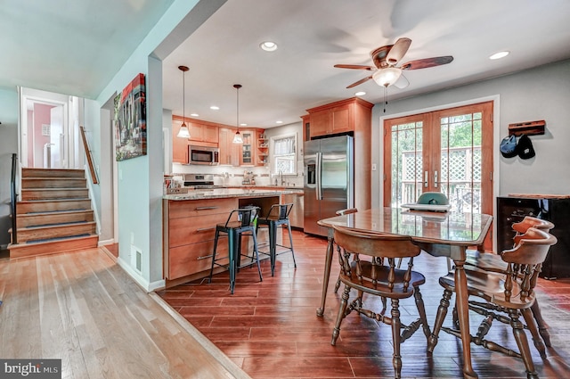 108 Strathdon Way, Lutherville Timonium, MD 21093 - dining area with a ceiling fan, wood finished floors, recessed lighting, stairs, and french doors