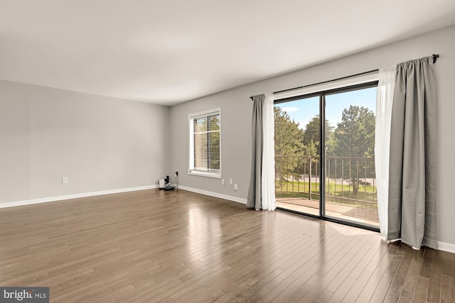 6930 Hanover Pkwy Unit 302, Greenbelt, MD 20770 - empty room featuring dark wood-style flooring and baseboards