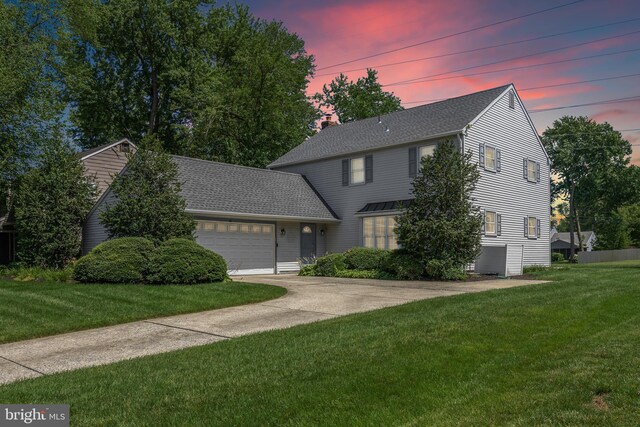 325 Tenby Chase Dr, Delran, NJ 08075 - view of front facade featuring a garage, a lawn, concrete driveway, and a shingled roof