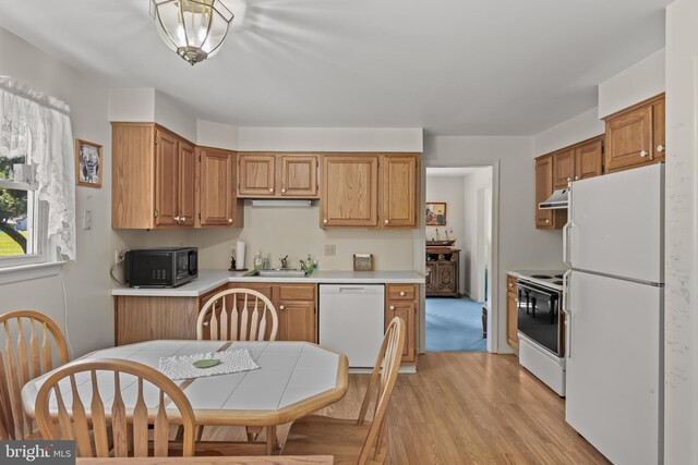 325 Tenby Chase Dr, Delran, NJ 08075 - kitchen featuring white appliances, under cabinet range hood, light wood-type flooring, and light countertops