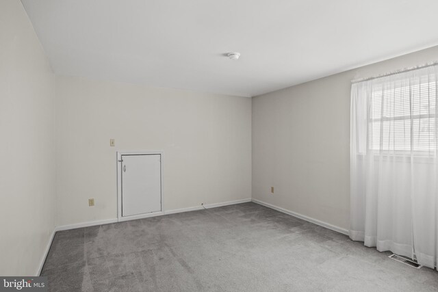 325 Tenby Chase Dr, Delran, NJ 08075 - carpeted empty room with a smoke detector and baseboards