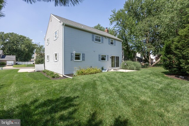 325 Tenby Chase Dr, Delran, NJ 08075 - back of property with a chimney and a yard
