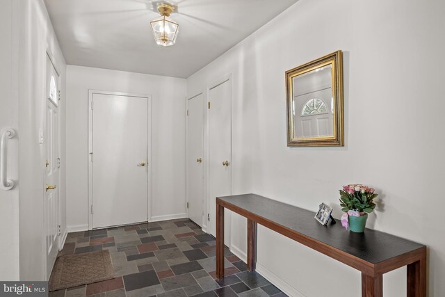 325 Tenby Chase Dr, Delran, NJ 08075 - entryway featuring stone finish flooring and baseboards