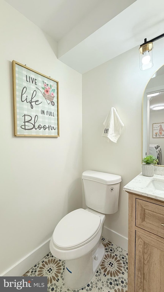 904 Man O War Ln, Great Falls, VA 22066 - half bath with vanity and tile patterned floors