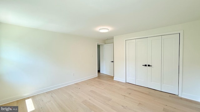 904 Man O War Ln, Great Falls, VA 22066 - unfurnished bedroom with light wood-style floors and a closet