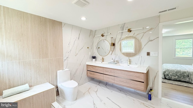 904 Man O War Ln, Great Falls, VA 22066 - ensuite bathroom with double vanity, marble finish floors, and recessed lighting