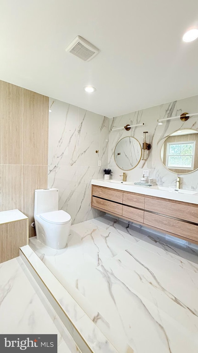 904 Man O War Ln, Great Falls, VA 22066 - full bathroom featuring marble tiled flooring, double vanity, and recessed lighting