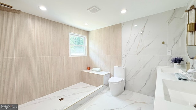 904 Man O War Ln, Great Falls, VA 22066 - full bathroom featuring tile walls, double vanity, marble tiled flooring, a shower, and recessed lighting