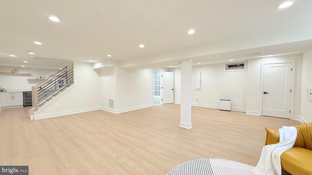 904 Man O War Ln, Great Falls, VA 22066 - finished basement featuring wine cooler, light wood-style floors, recessed lighting, and stairs