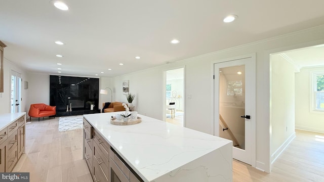 904 Man O War Ln, Great Falls, VA 22066 - kitchen featuring crown molding, light wood-style floors, recessed lighting, a center island, and light stone countertops