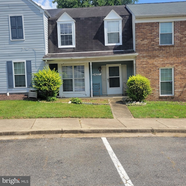 2407 E Rosecroft Village Cir, Oxon Hill, MD 20745 - view of front of house featuring covered porch, uncovered parking, and roof with shingles