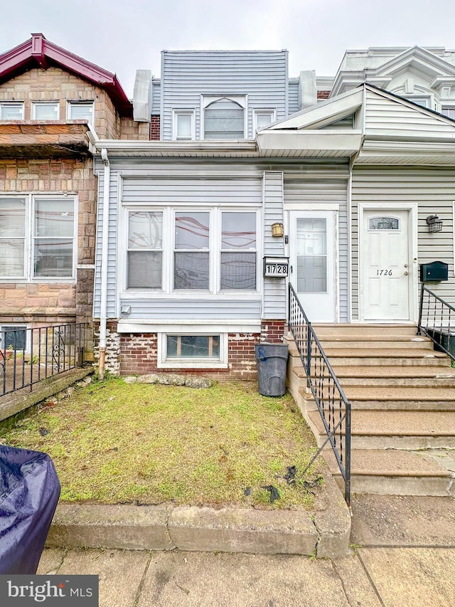 1728 S 54th St, Philadelphia, PA 19143 - townhome / multi-family property featuring entry steps and a front lawn