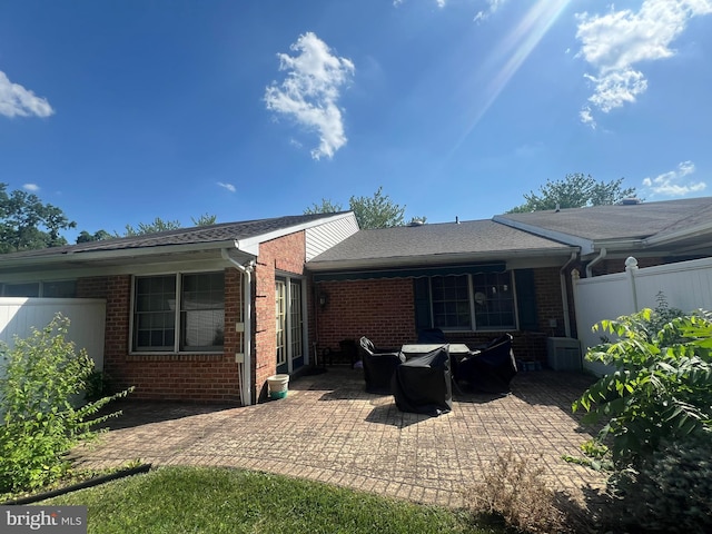 1038 Matthew Ct, Hagerstown, MD 21742 - rear view of property with brick siding, a patio, and roof with shingles