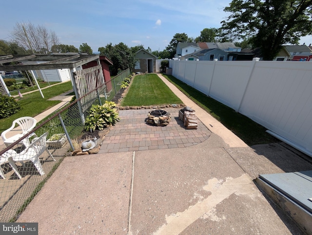 135 N 2nd St, Coplay, PA 18037 - fenced backyard featuring a patio area and an outdoor fire pit