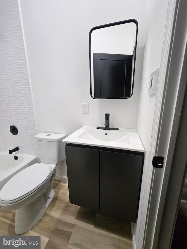 3239 N 13th St, Philadelphia, PA 19140 - bathroom with vanity, wood finished floors, and bathing tub / shower combination