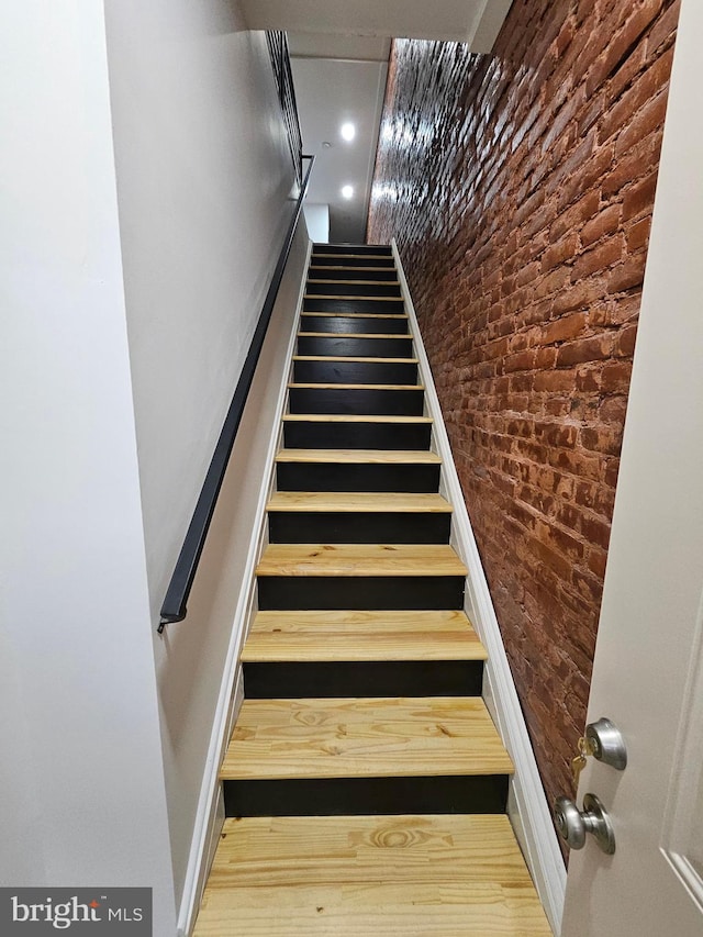 3239 N 13th St, Philadelphia, PA 19140 - staircase featuring brick wall and wood finished floors
