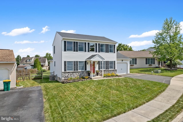 1015 Jodie Ct, Pennsburg, PA 18073 - view of front of home with driveway, an attached garage, and stone siding