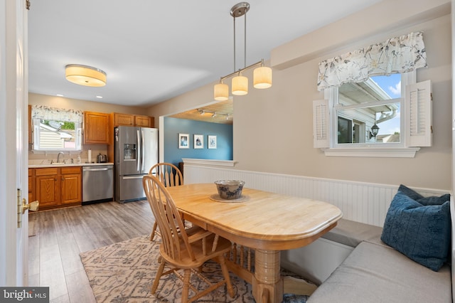 1015 Jodie Ct, Pennsburg, PA 18073 - dining area featuring a wainscoted wall and light wood-style flooring