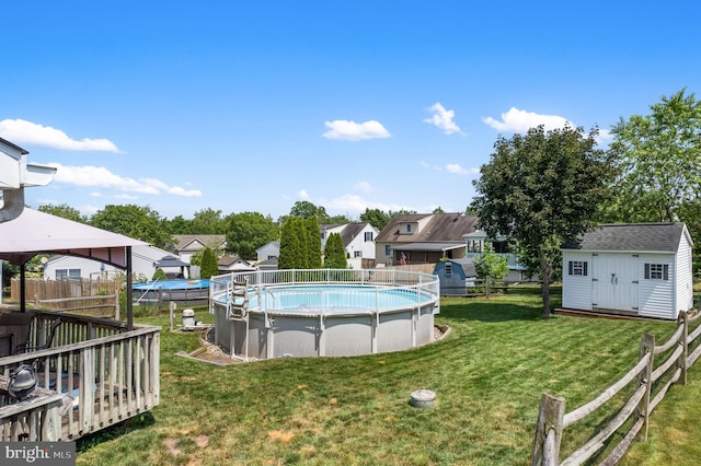 1015 Jodie Ct, Pennsburg, PA 18073 - view of pool with a storage unit, a wooden deck, and a residential view