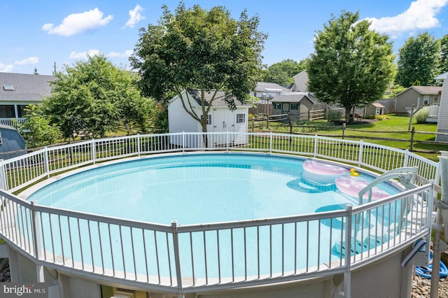 1015 Jodie Ct, Pennsburg, PA 18073 - view of swimming pool featuring a residential view and a storage shed