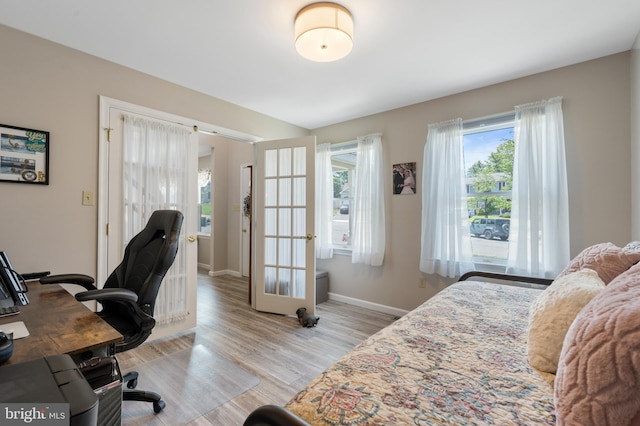 1015 Jodie Ct, Pennsburg, PA 18073 - bedroom featuring french doors, light wood-style floors, and an office area