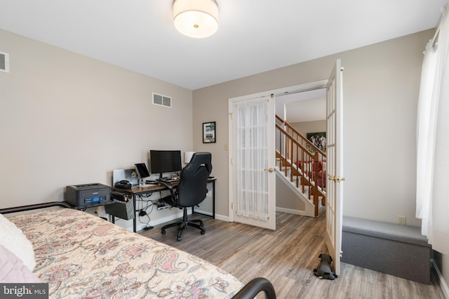 1015 Jodie Ct, Pennsburg, PA 18073 - bedroom featuring wood finished floors, french doors, and a desk
