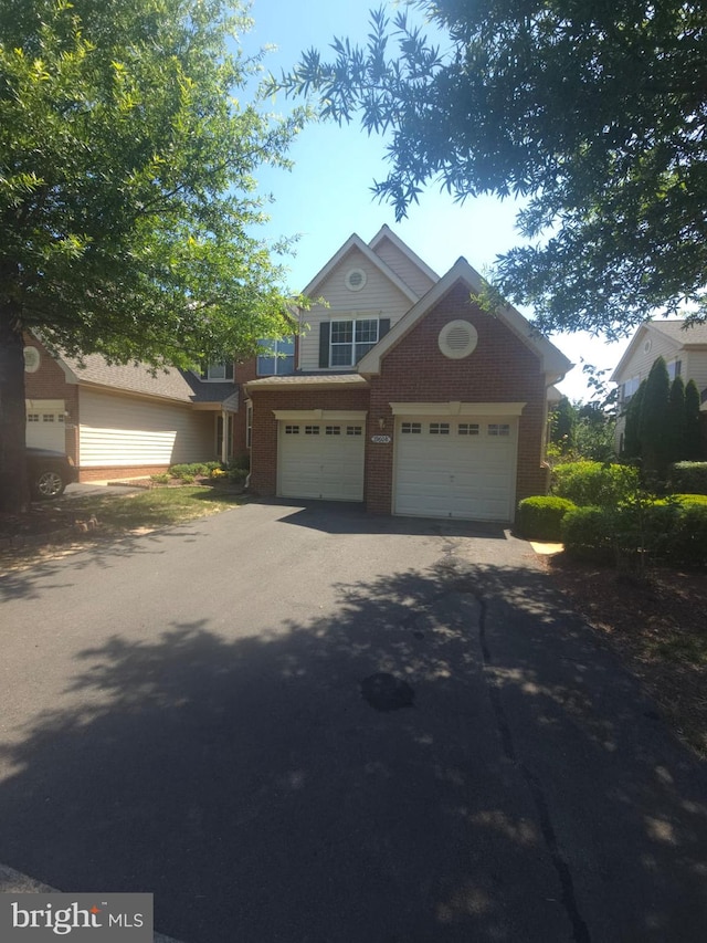 19608 Edgemont Sq, Ashburn, VA 20147 - view of front of property featuring driveway and a garage