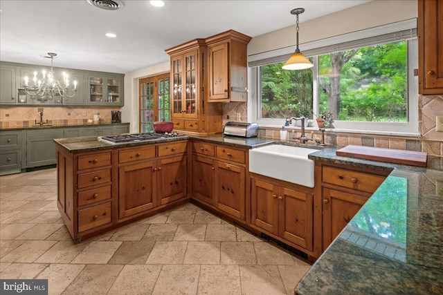 1 High Acres Dr, Ewing, NJ 08628 - kitchen featuring stone tile flooring, backsplash, stainless steel gas stovetop, a chandelier, and recessed lighting