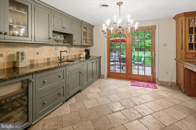 1 High Acres Dr, Ewing, NJ 08628 - kitchen featuring wine cooler, stone tile flooring, gray cabinets, and tasteful backsplash