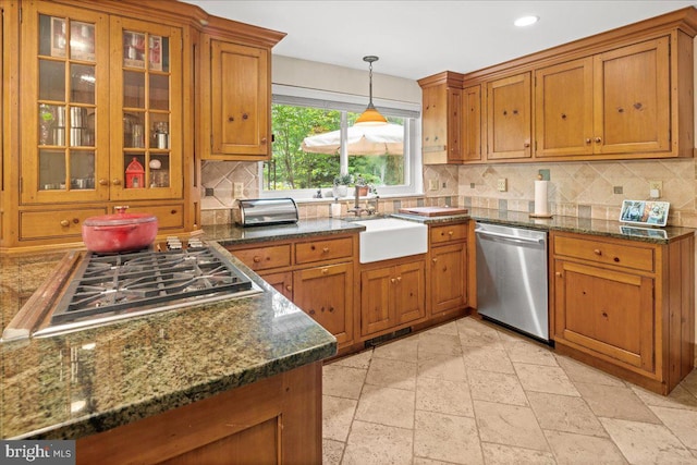 1 High Acres Dr, Ewing, NJ 08628 - kitchen with appliances with stainless steel finishes, brown cabinetry, tasteful backsplash, stone tile floors, and pendant lighting