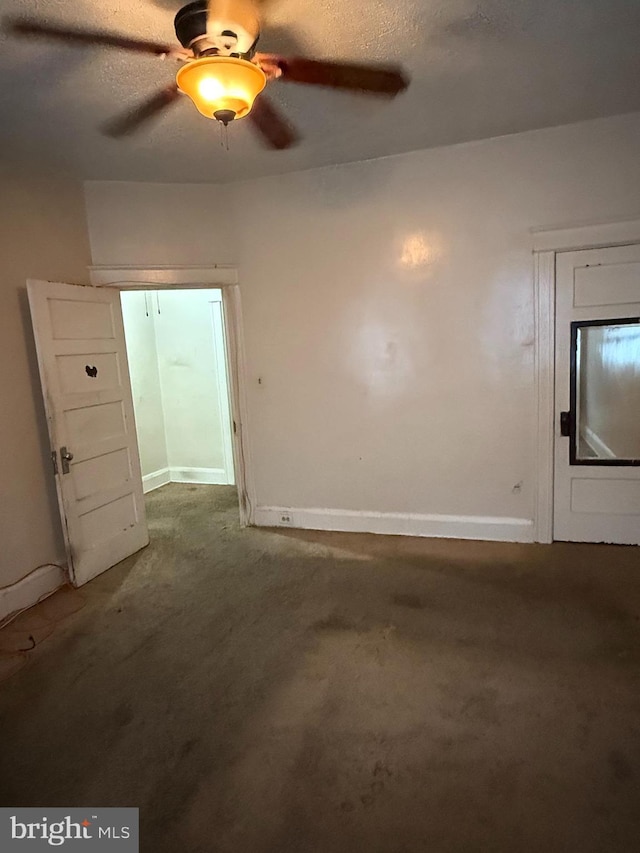 1812 E 32nd St, Baltimore, MD 21218 - unfurnished living room featuring ceiling fan, carpet flooring, and a textured ceiling