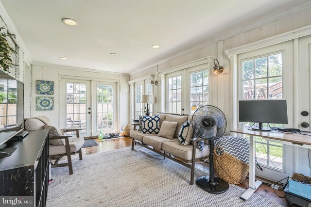 614 Radnor Ave, Haddonfield, NJ 08033 - living room featuring ornamental molding, healthy amount of natural light, french doors, wood finished floors, and a decorative wall