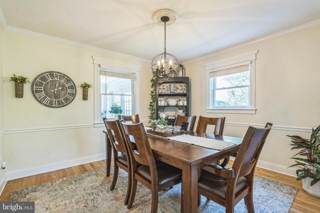 614 Radnor Ave, Haddonfield, NJ 08033 - dining area featuring a chandelier, light wood-style floors, and ornamental molding