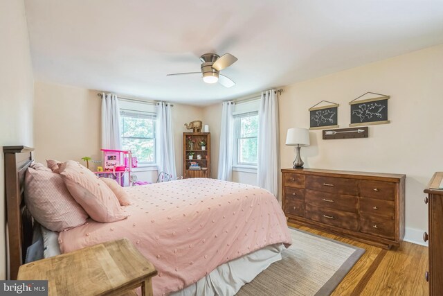 614 Radnor Ave, Haddonfield, NJ 08033 - bedroom with multiple windows, wood finished floors, and a ceiling fan